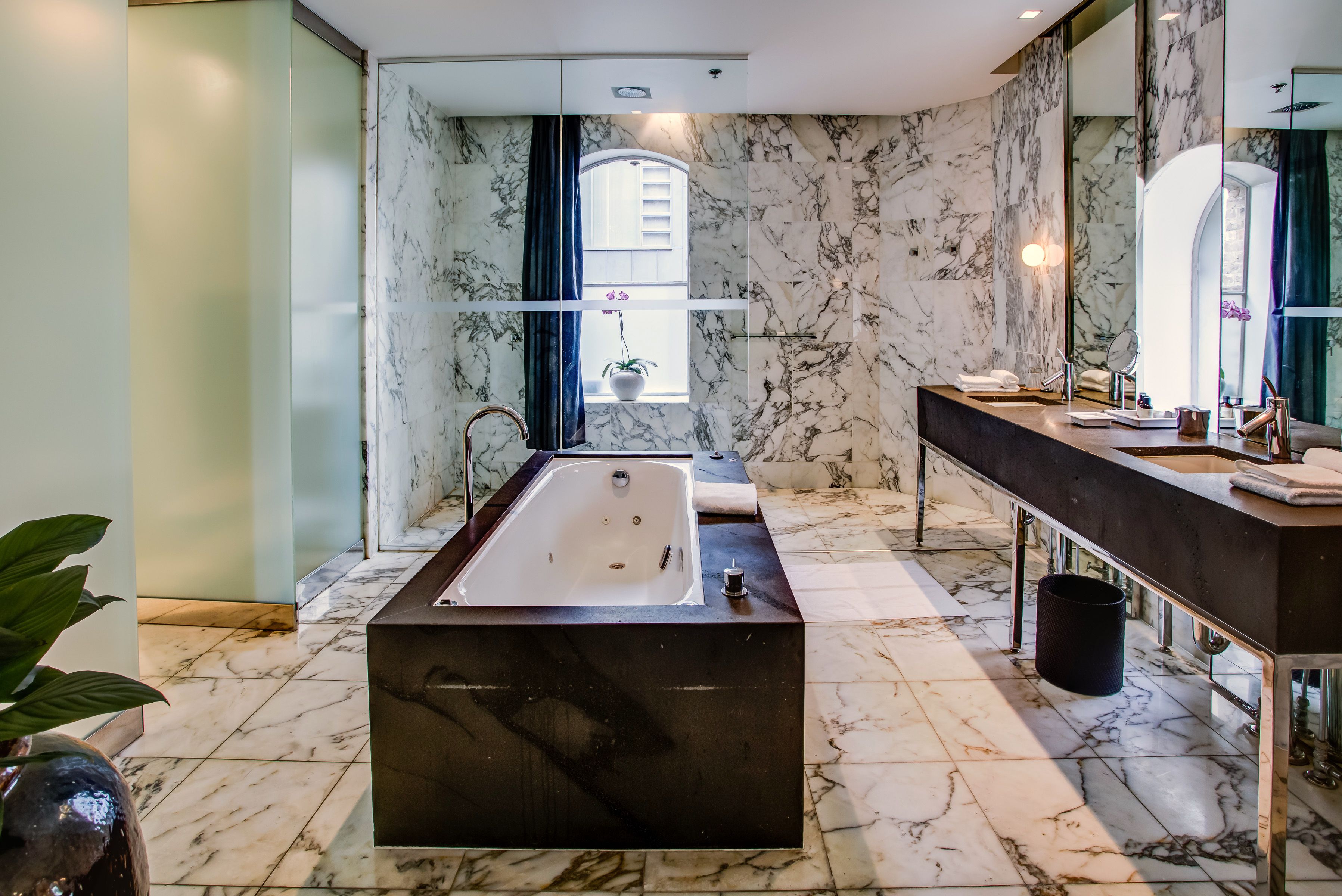 loft penthouse | bathroom | shower, rainfall showerhead, designer toiletries, hair dryer