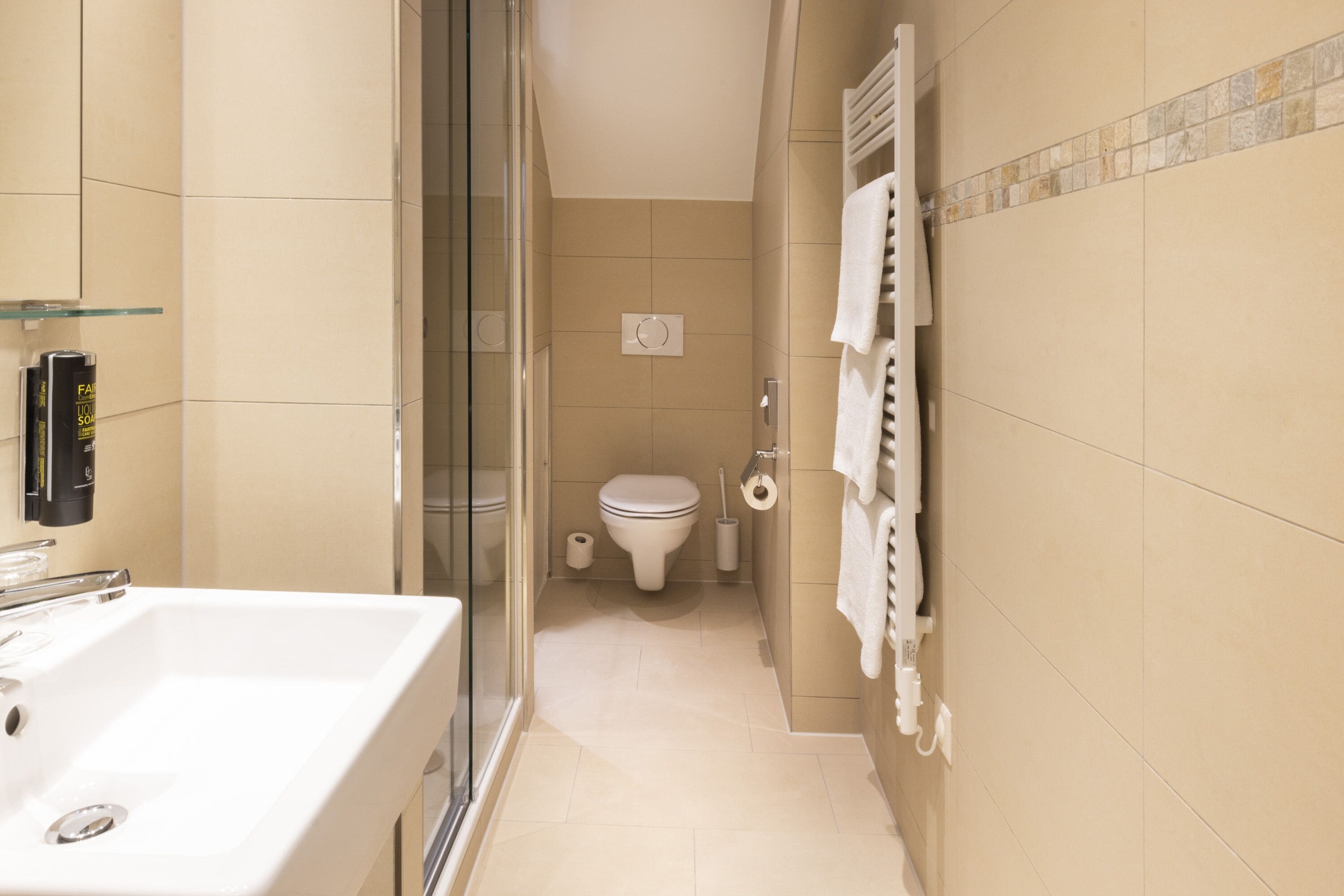 junior suite plus | bathroom | eco-friendly toiletries, hair dryer, towels, soap