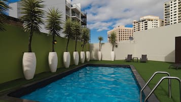Outdoor pool, open 6:00 AM to 10:00 PM, pool umbrellas, pool loungers