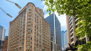 A multi-story hotel with a curved facade, large windows, and a prominent entrance. - Mantra 2 Bond Street Sydney (Sydney)