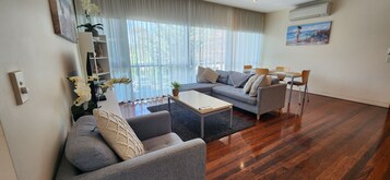 Deluxe Two-Bedroom Apartment | Living area | Smart TV