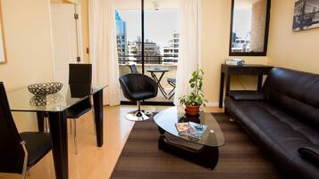 Deluxe Apartment, 1 Bedroom, Non Smoking | Living area | 32-inch flat-screen TV with satellite channels, TV, DVD player
