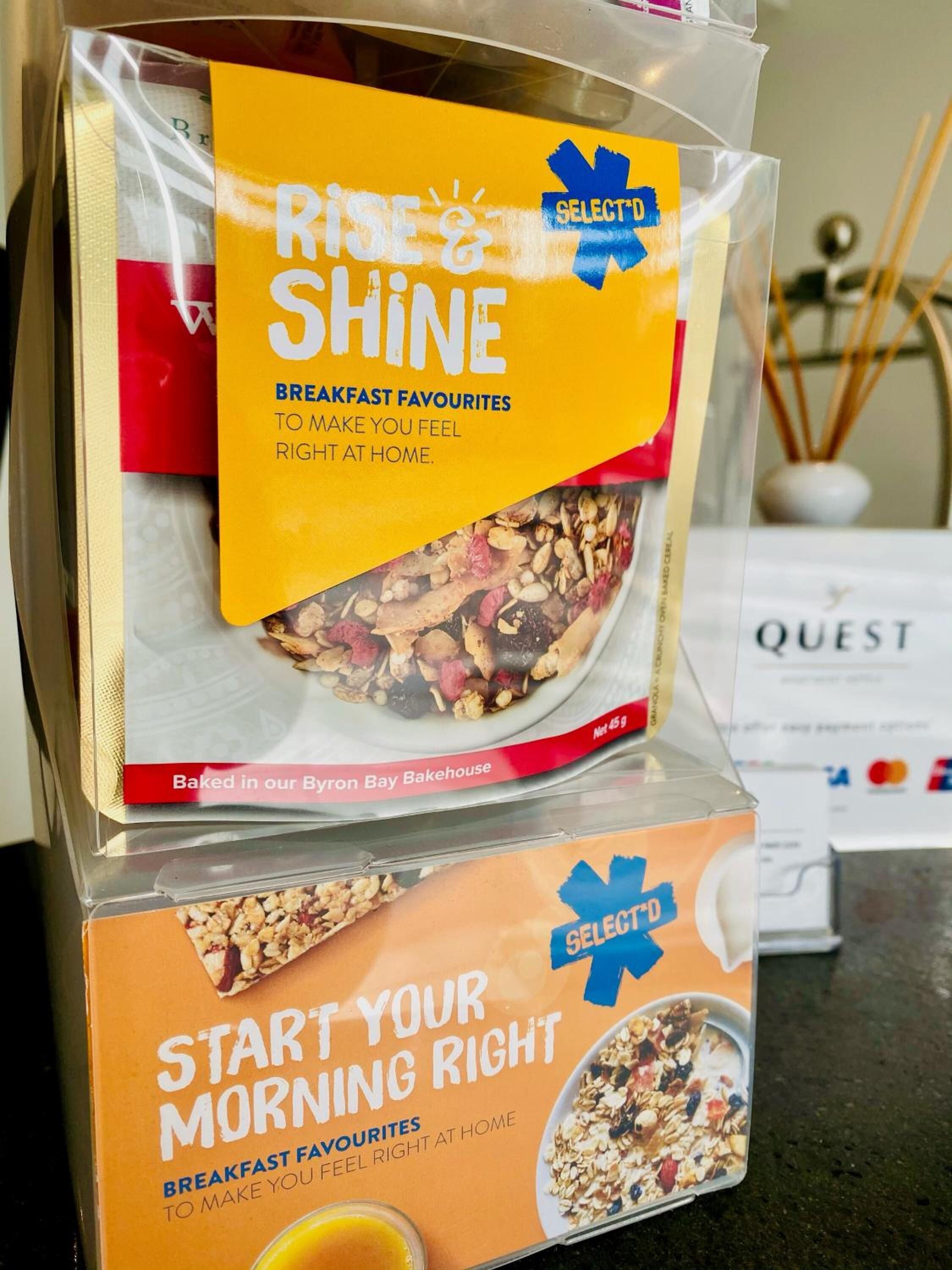 A packaged breakfast product with a yellow label that reads "RISE & SHINE" and "SELECT".
