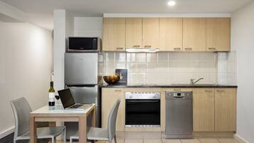 Studio Apartment | Private kitchen | Fridge, microwave, oven, stovetop