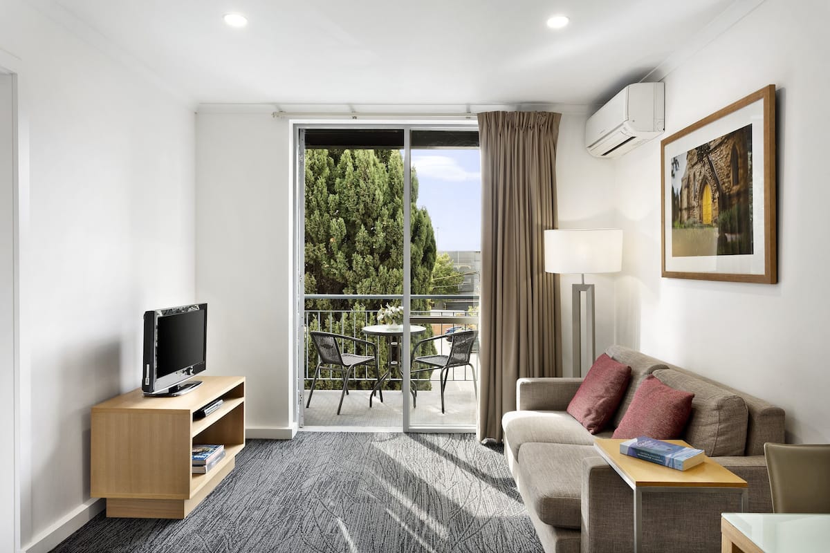 One Bedroom Apartment | Living area | 32-inch LCD TV with digital channels, TV, DVD player