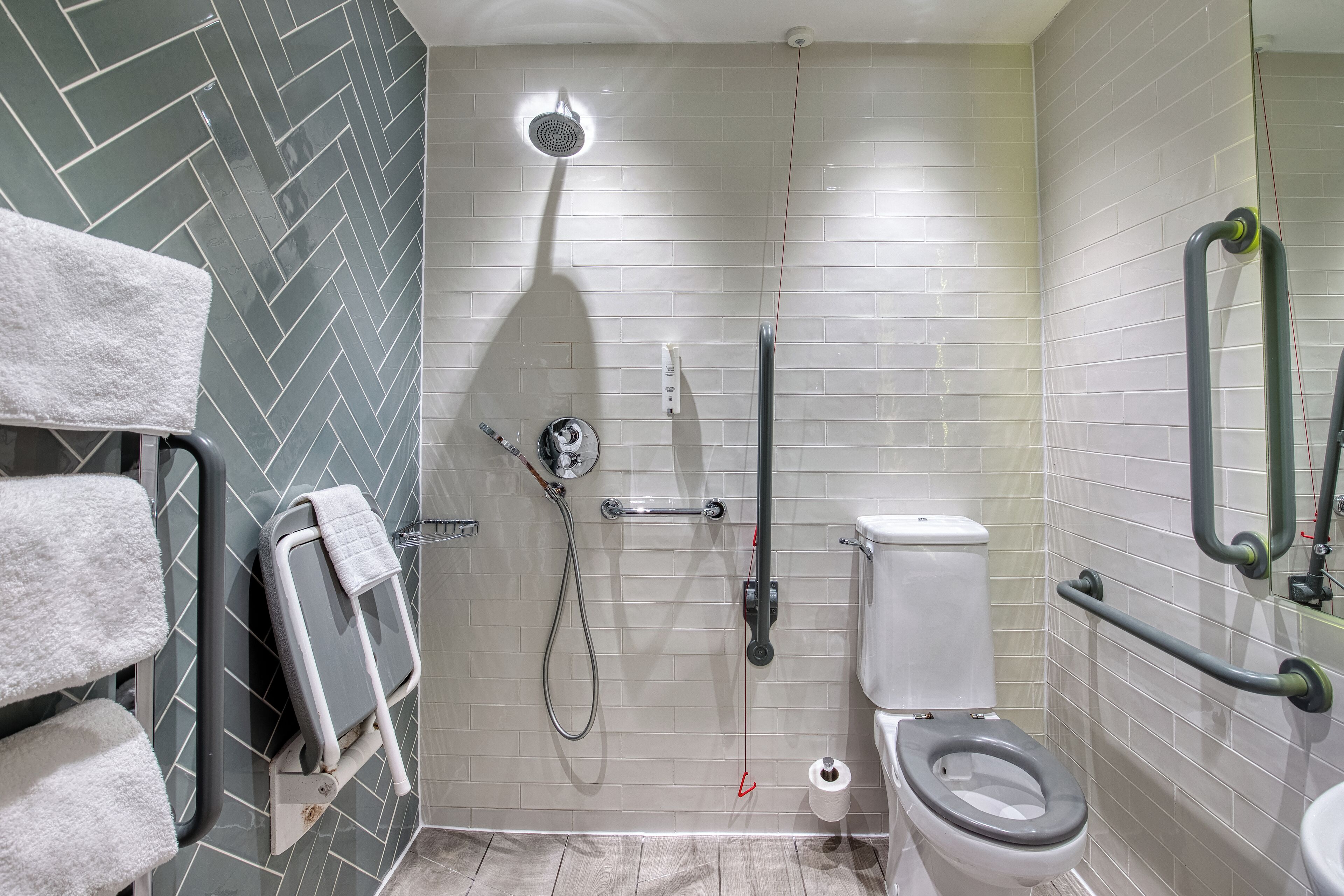comfort room (cy) | bathroom | eco-friendly toiletries, hair dryer, towels, soap
