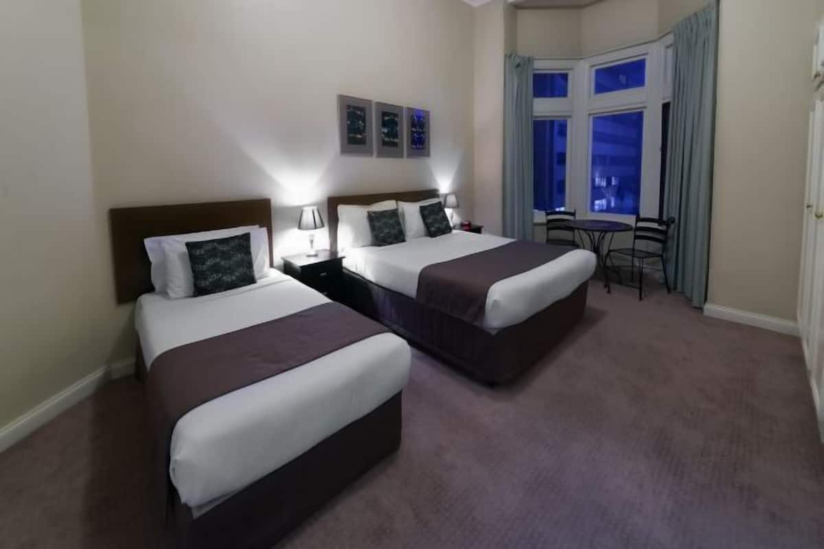 Premium bedding, laptop workspace, iron/ironing board, cribs/infant beds