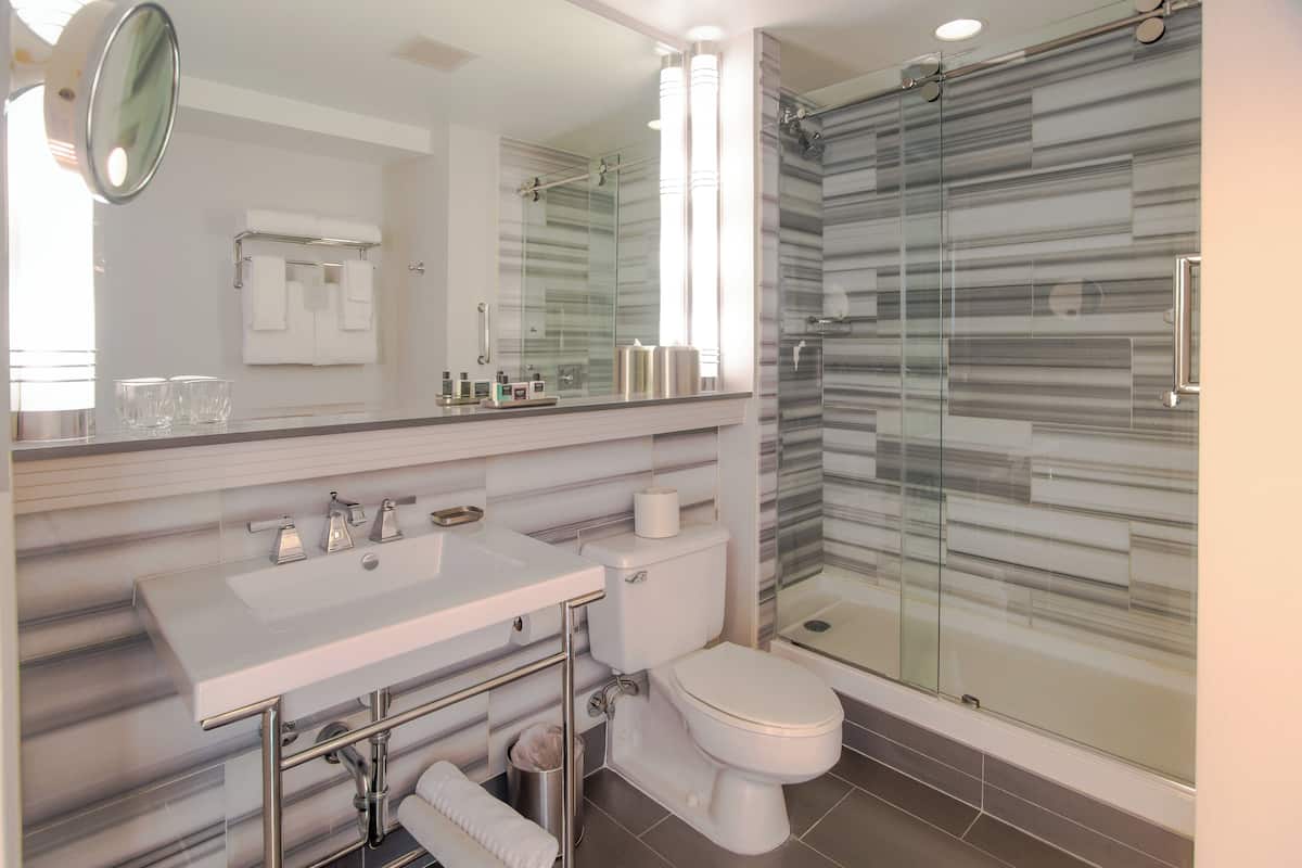 Designer toiletries, hair dryer, towels, soap