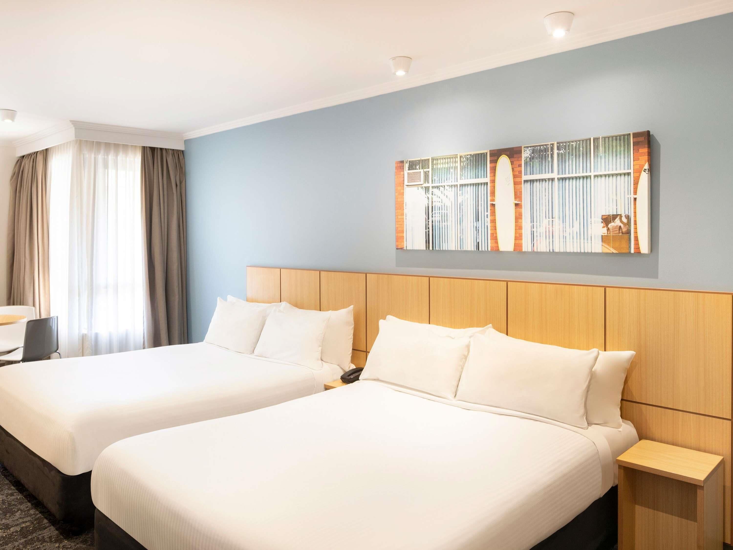 Standard Room, 2 Queen Beds | In-room safe, iron/ironing board, free cribs/infant beds, rollaway beds