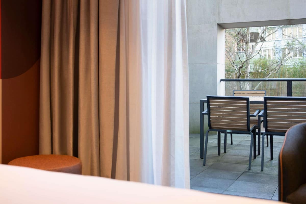 Deluxe Room, 1 Queen Bed, Balcony | 1 bedroom, in-room safe, laptop workspace, blackout drapes
