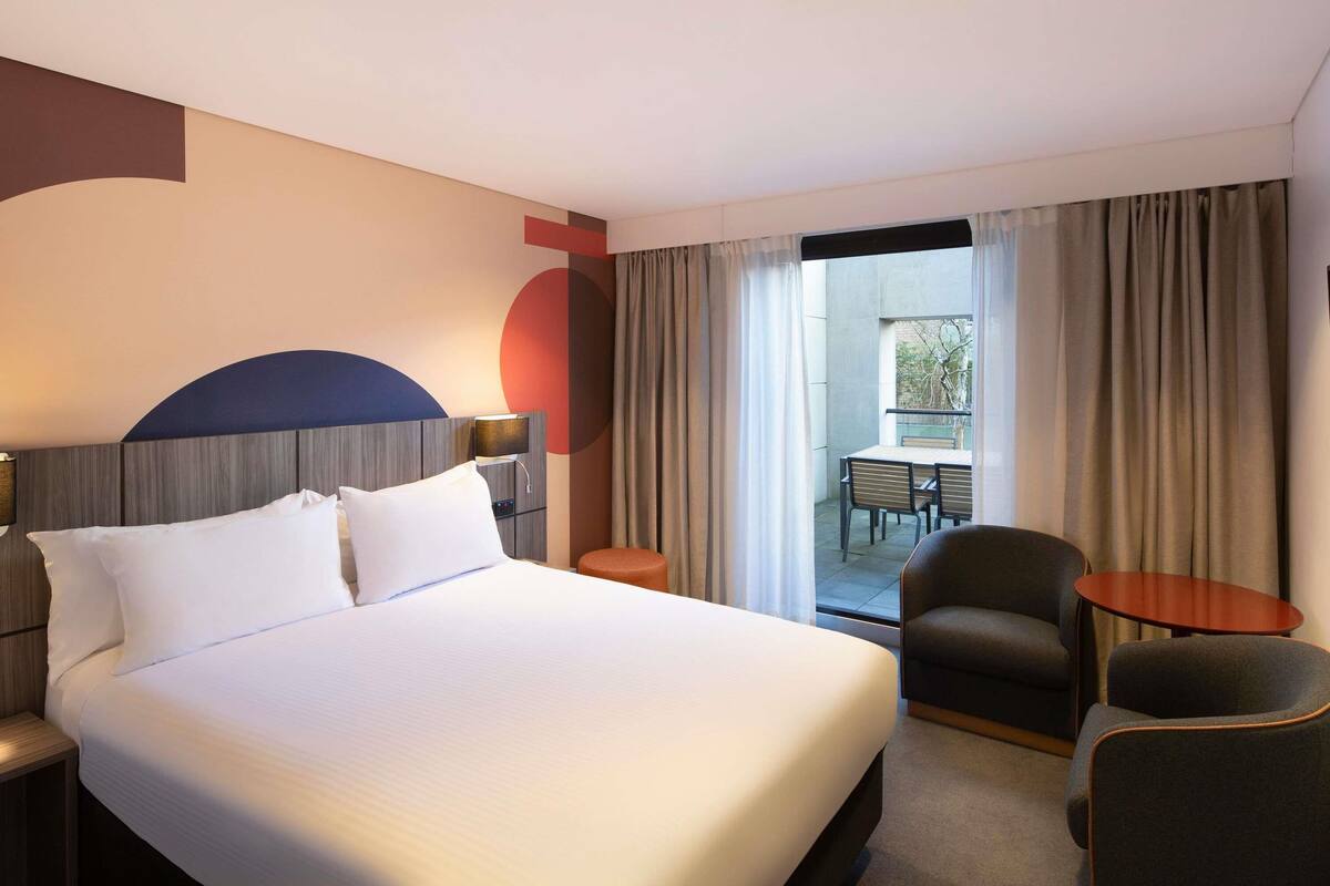 Deluxe Room, 1 Queen Bed, Balcony | In-room safe, laptop workspace, blackout drapes, iron/ironing board