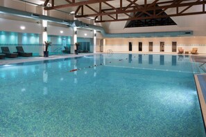 Indoor pool, open 7 AM to 9:00 PM, pool loungers