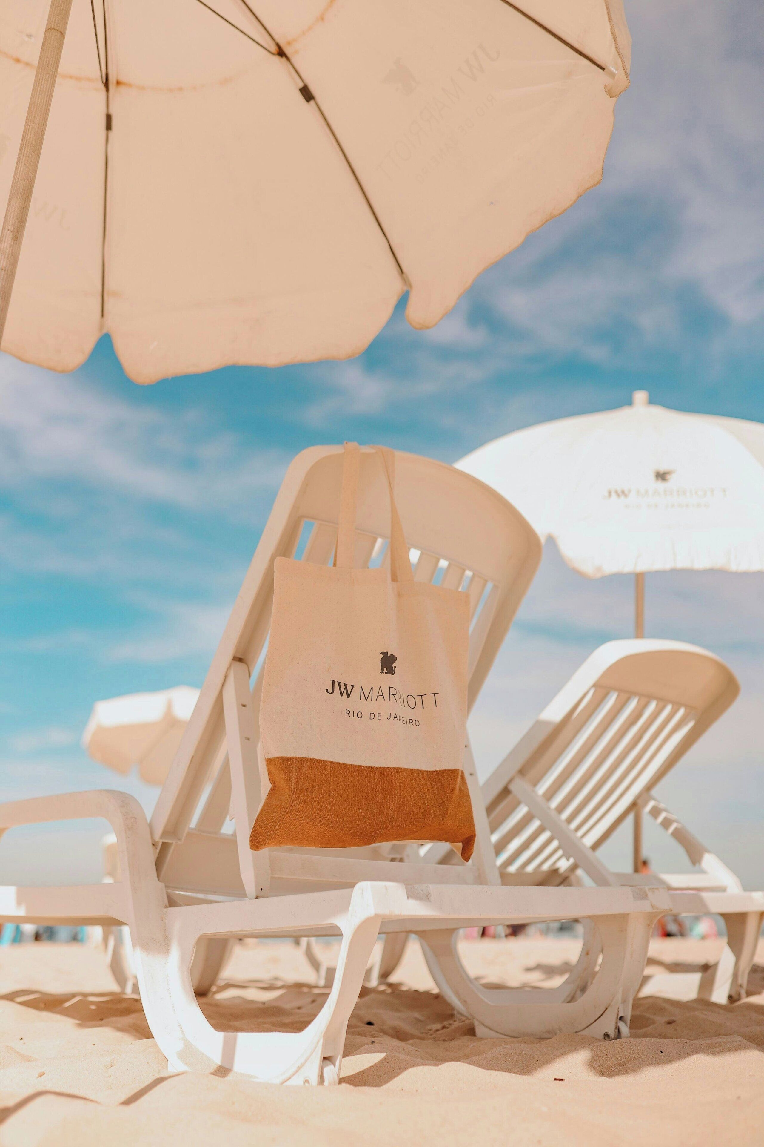 on the beach, sun-loungers, beach umbrellas, beach towels
