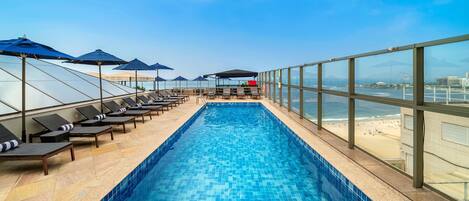 Outdoor pool, free pool cabanas, pool umbrellas