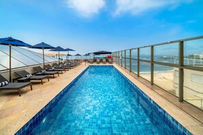 Outdoor pool, free cabanas, pool umbrellas