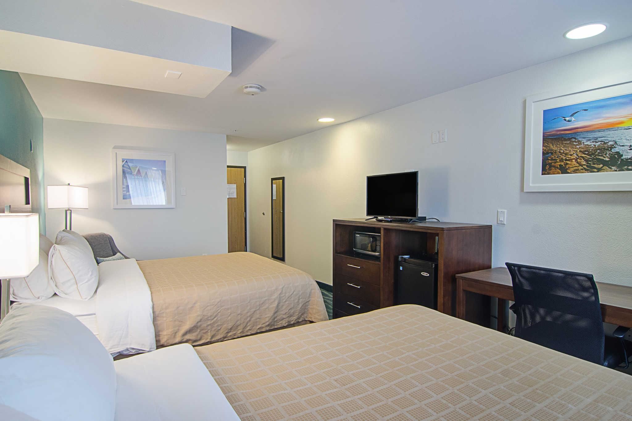 standard room, 2 queen beds, non smoking | pillow-top beds, desk, blackout curtains, iron/ironing board