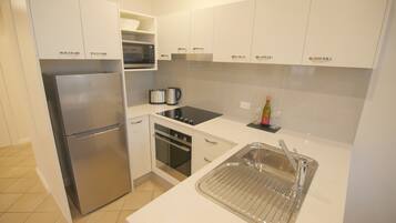 Mini-fridge, microwave, stovetop, coffee/tea maker