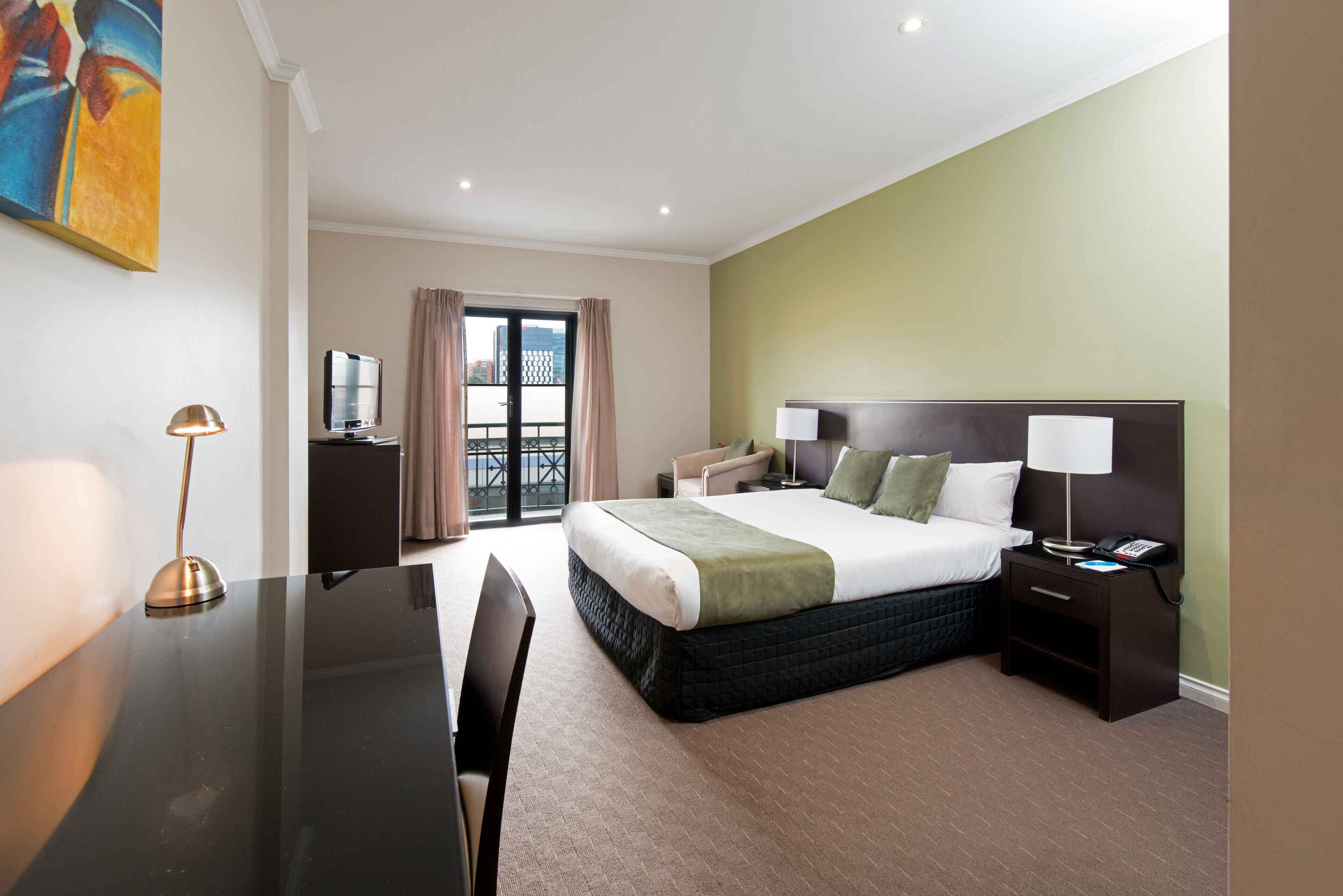 desk, laptop workspace, iron/ironing board, cots/infant beds