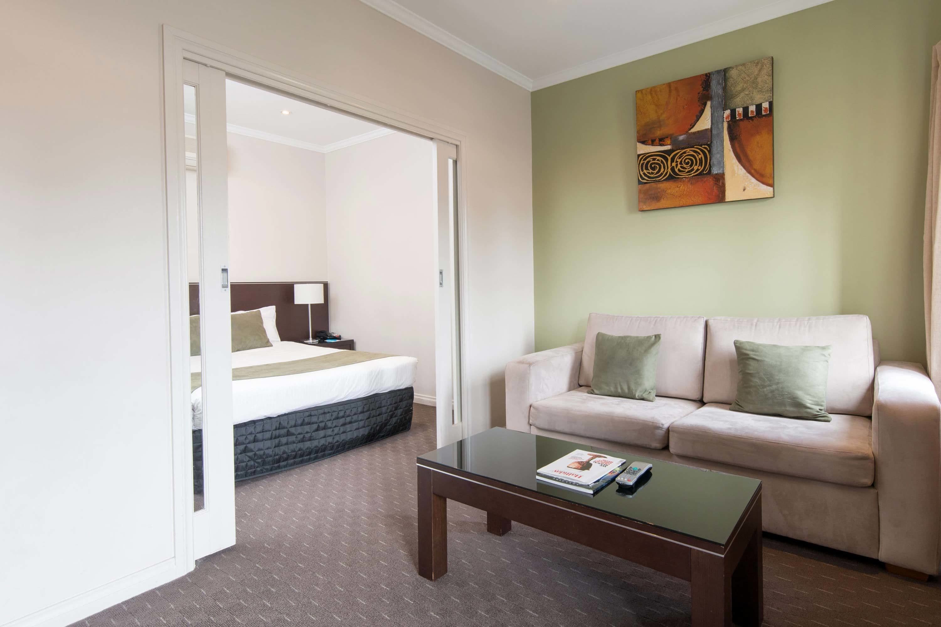 desk, laptop workspace, iron/ironing board, cots/infant beds