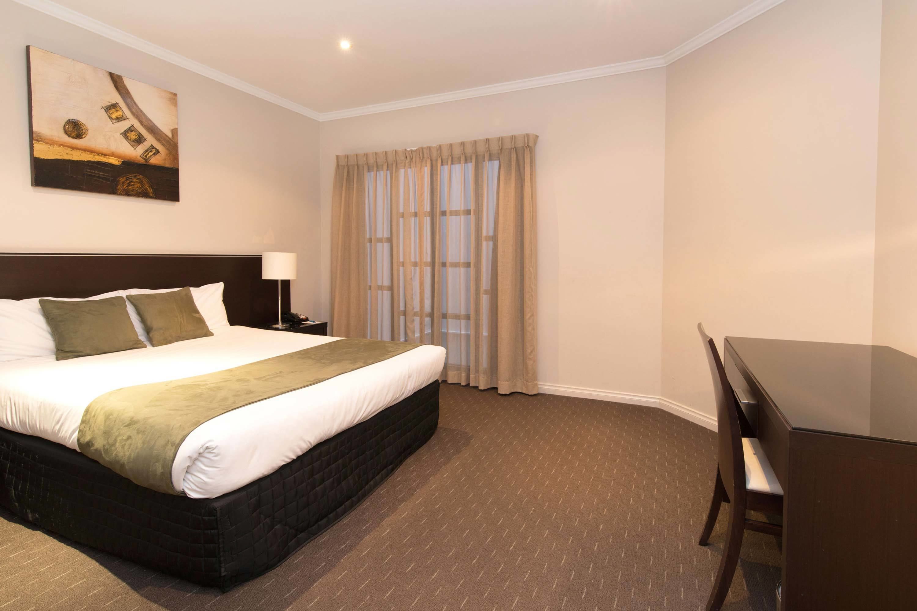 desk, laptop workspace, iron/ironing board, cots/infant beds