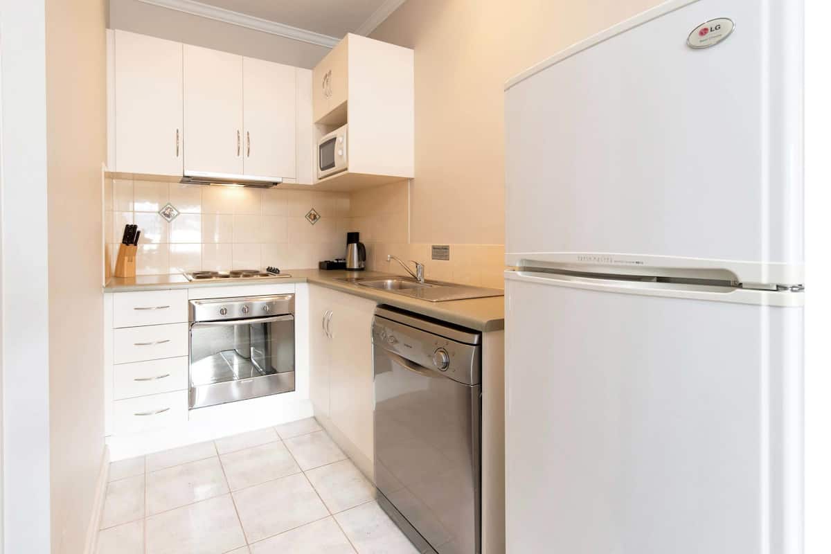 fridge, electric kettle, high chair, cookware/dishes/utensils