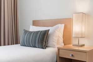 Premium bedding, desk, blackout drapes, iron/ironing board