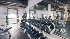 A gym with weight racks, dumbbells, and exercise equipment. - Best Western Plus Hotel Odense (Odense)