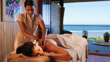 Experience a tranquil ocean view from the comfort of a massage table, surrounded by soothing ambiance and attentive care.
