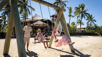 On the beach, white sand, free beach cabanas, sun loungers