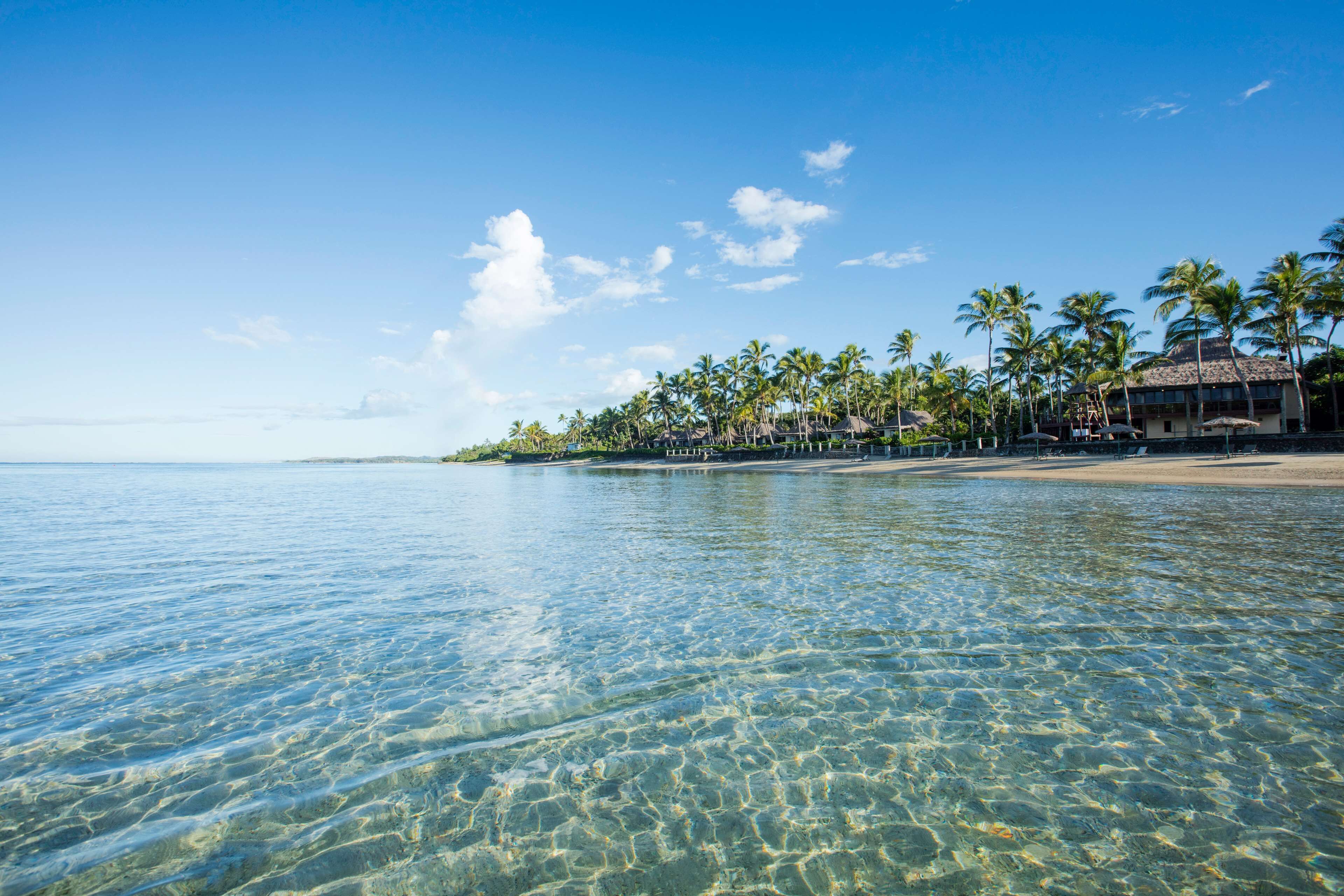 On the beach, white sand, free beach cabanas, sun-loungers