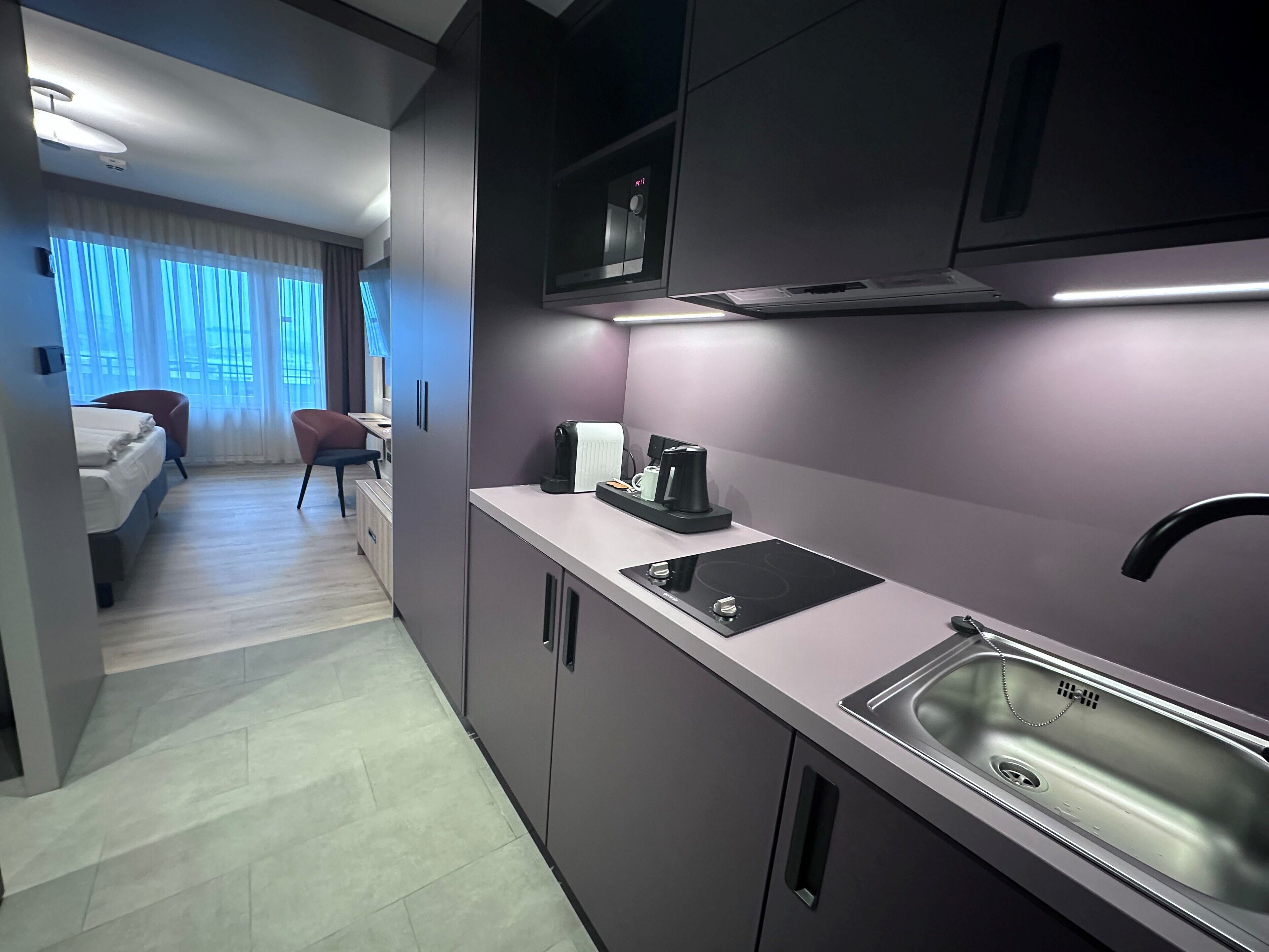 fridge, microwave, coffee/tea maker, cookware/dishes/utensils