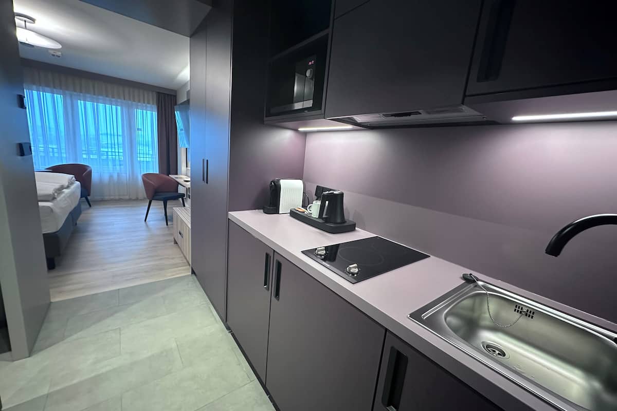 fridge, microwave, coffee/tea maker, cookware/dishes/utensils