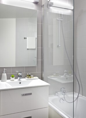 Combined shower/tub, hair dryer, towels, soap