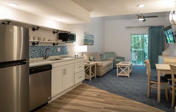 Loft (Caifornia King - Not Pet Friendly) | Living area | Flat-screen TV at Palmera Inn and Suites