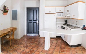 Suite, 2 Double Beds | Private kitchen | Fridge, stovetop, coffee/tea maker