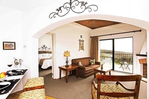 Suite, 1 King Bed | Living room | TV