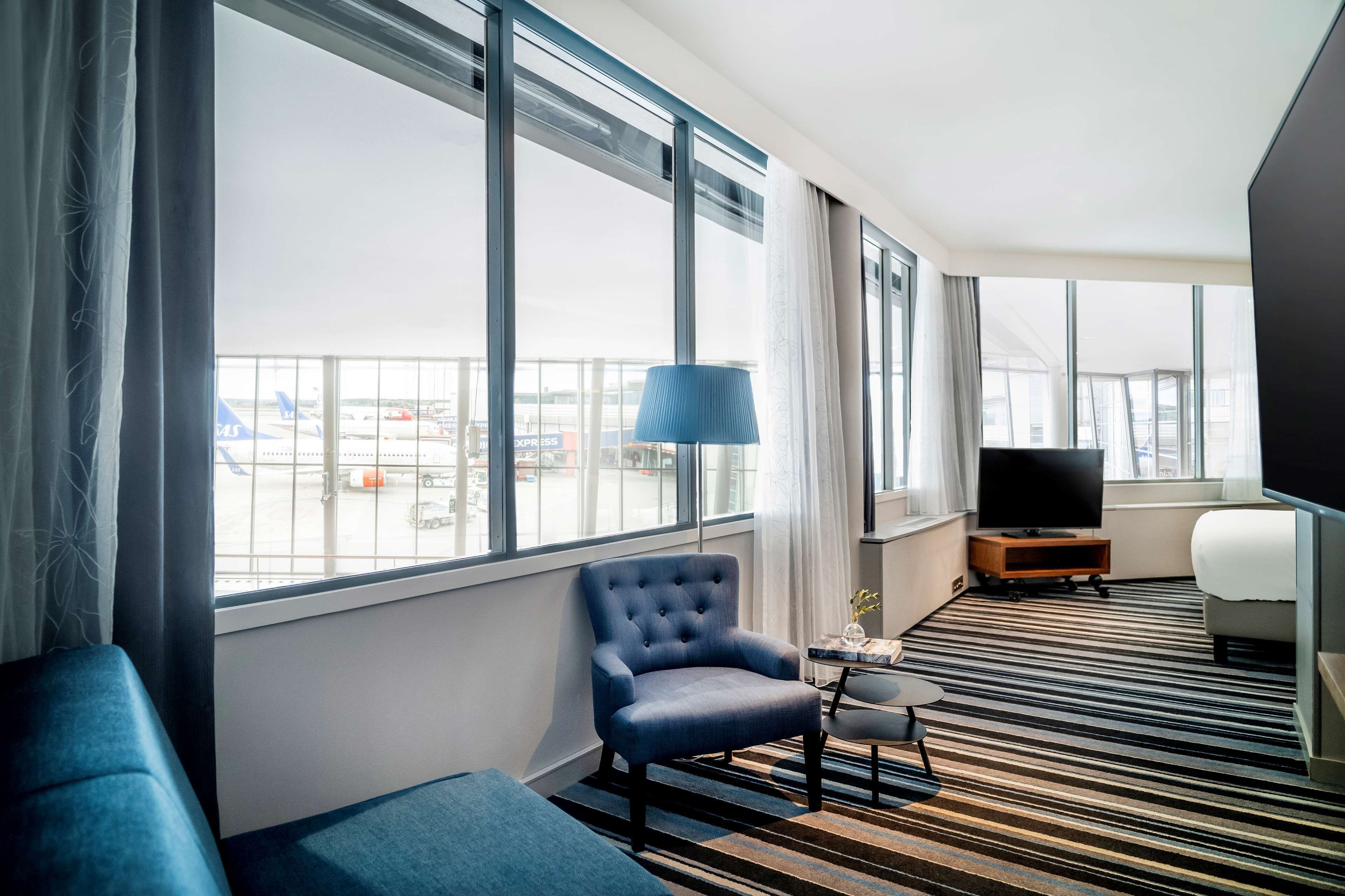junior suite (runway view) | hypo-allergenic bedding, minibar, in-room safe, desk