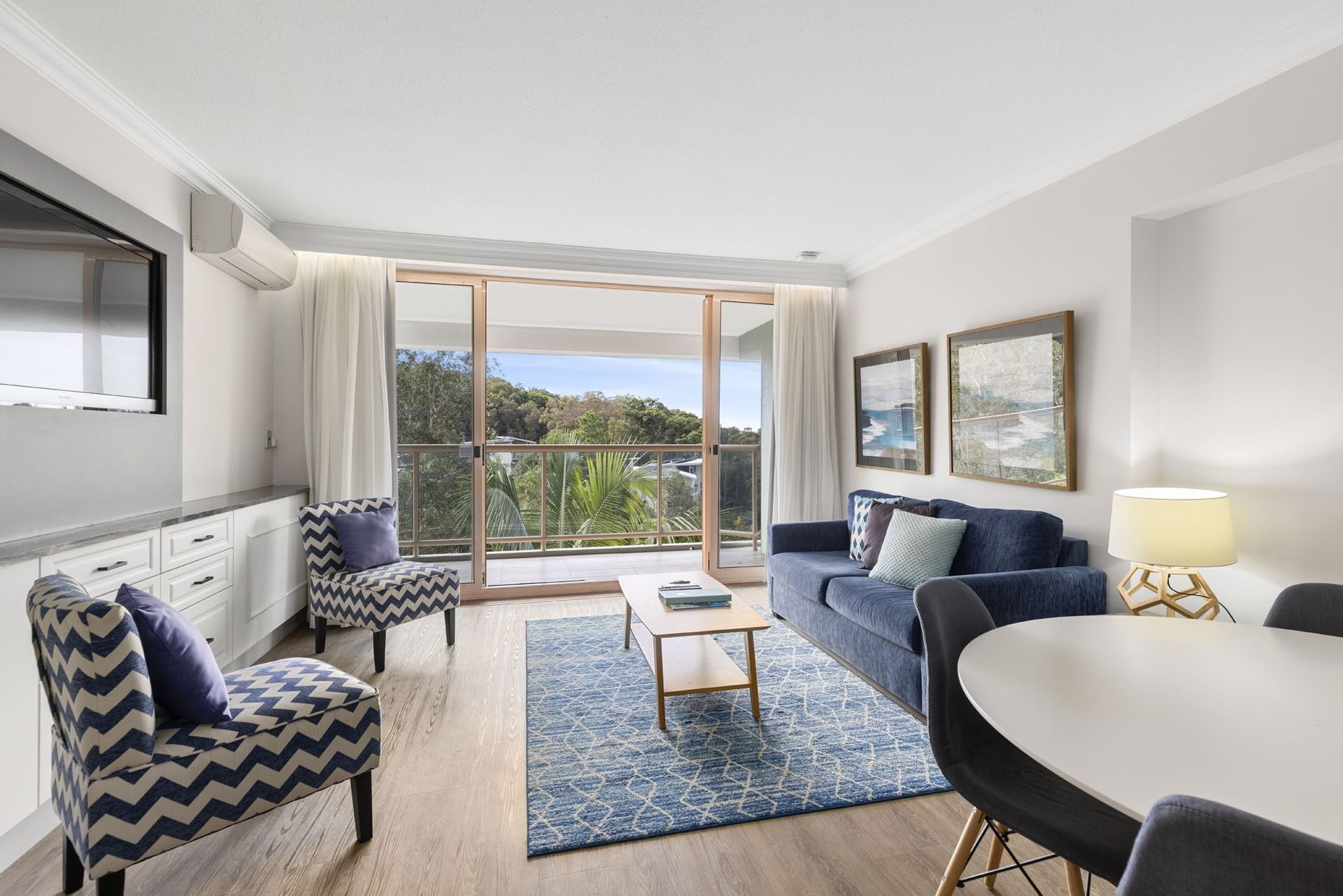 deluxe one bedroom apartment | living area | 32-inch tv with satellite channels