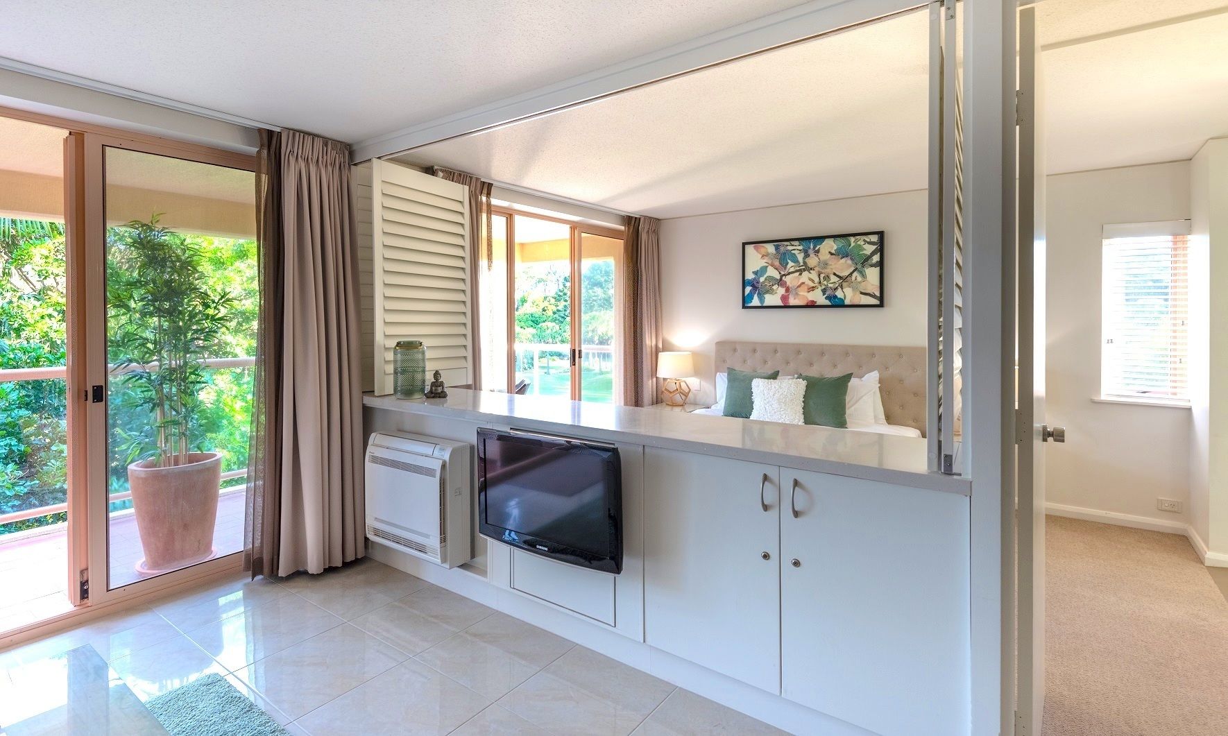 executive one bedroom apartment | living area | 32-inch tv with satellite channels