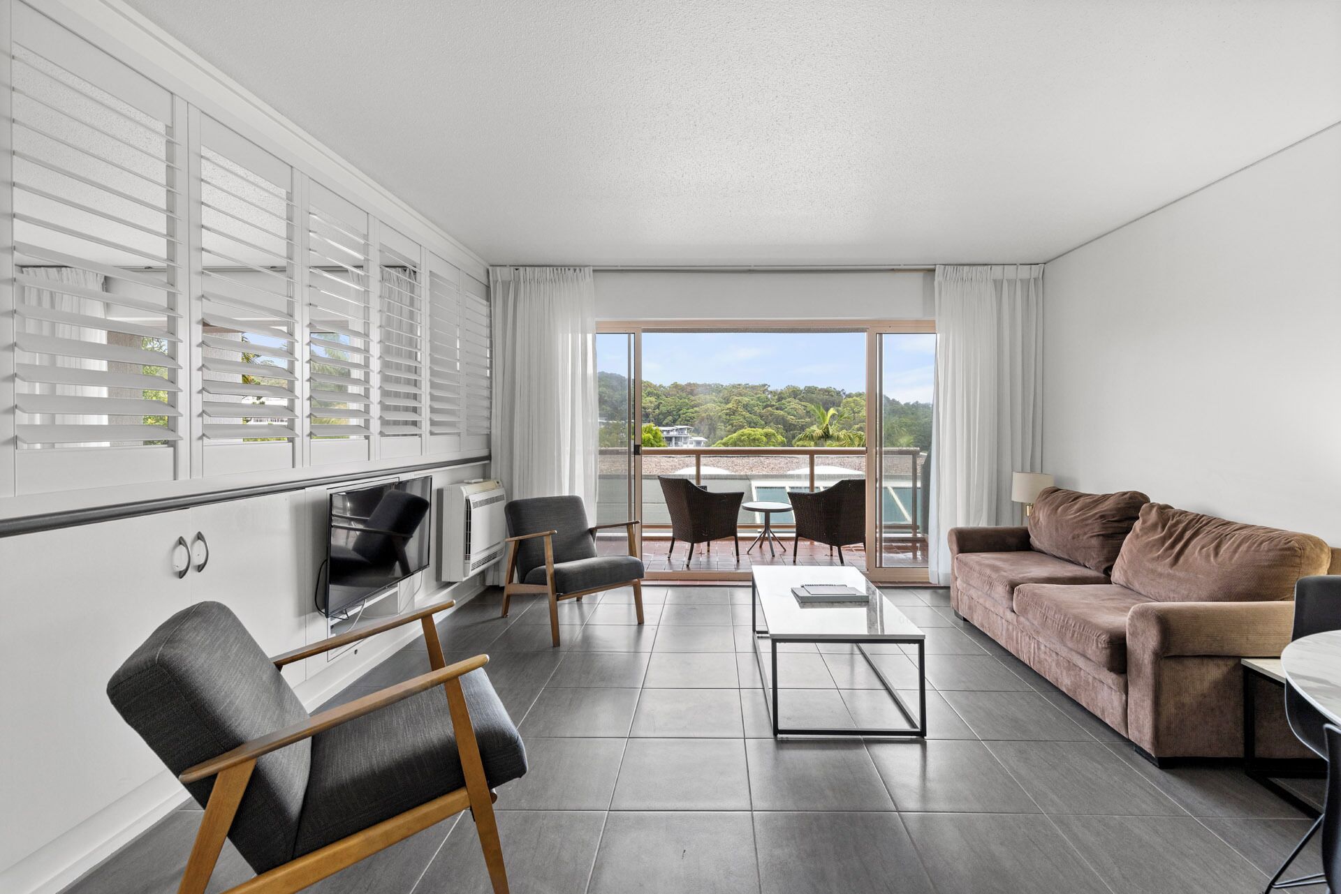 Terrace One Bedroom Apartment | Living area | 32-inch TV with satellite channels