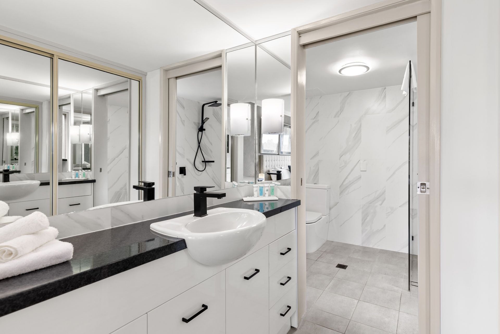 deluxe one bedroom apartment | bathroom | shower, free toiletries, hair dryer, towels