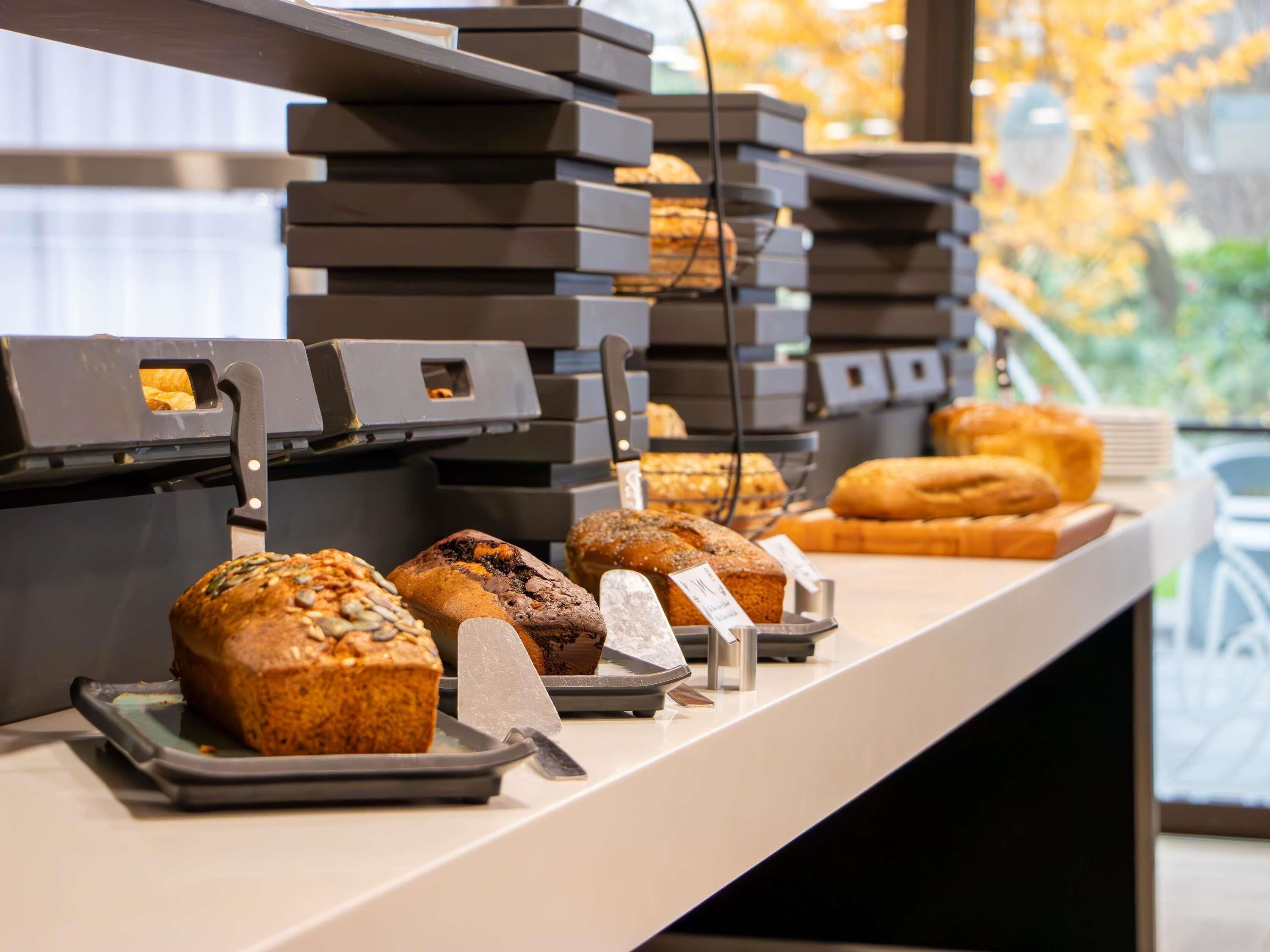 A bakery display with various baked goods.