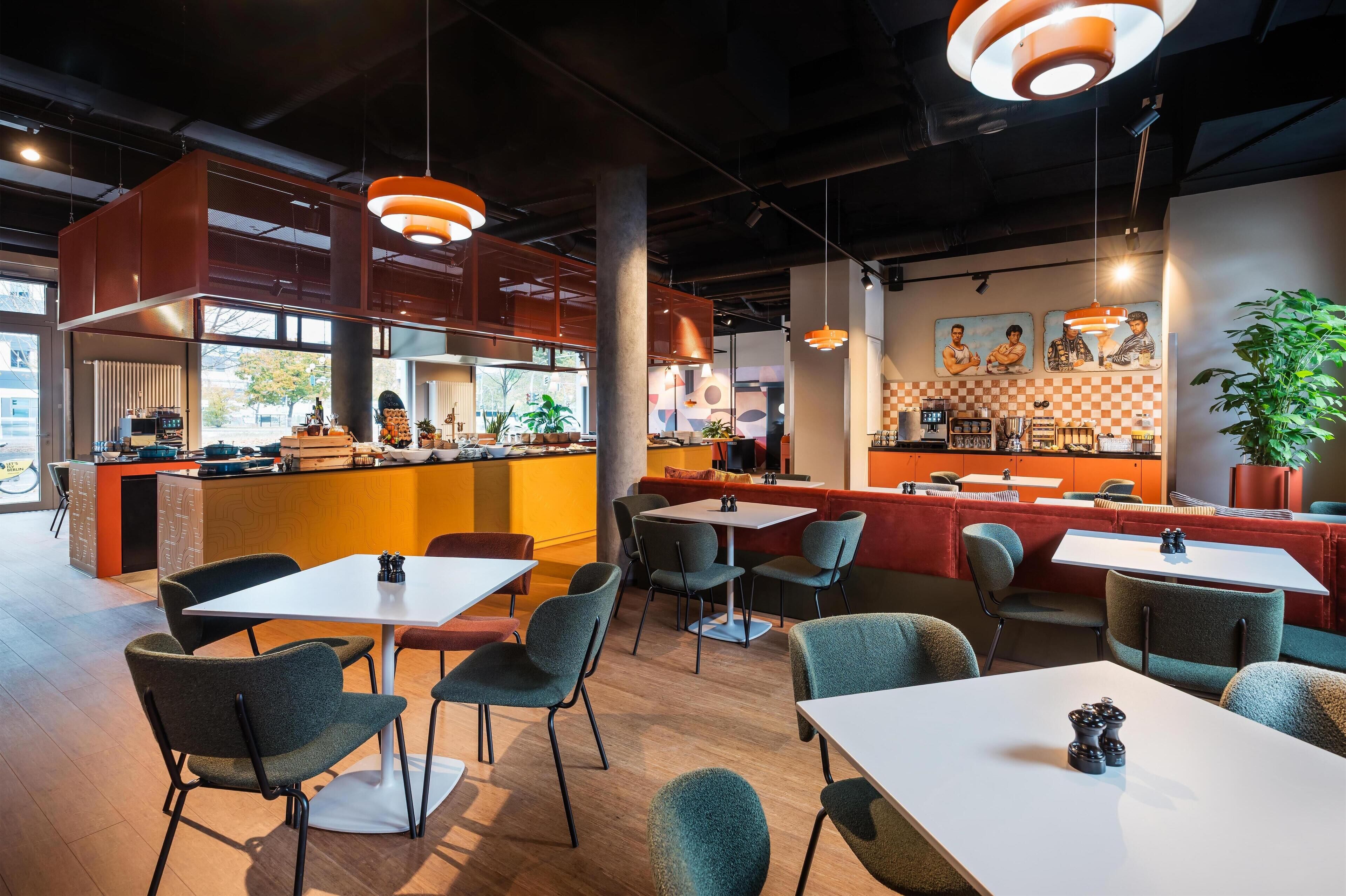 A modern cafe with a bar area, seating arrangements, and a large potted plant.