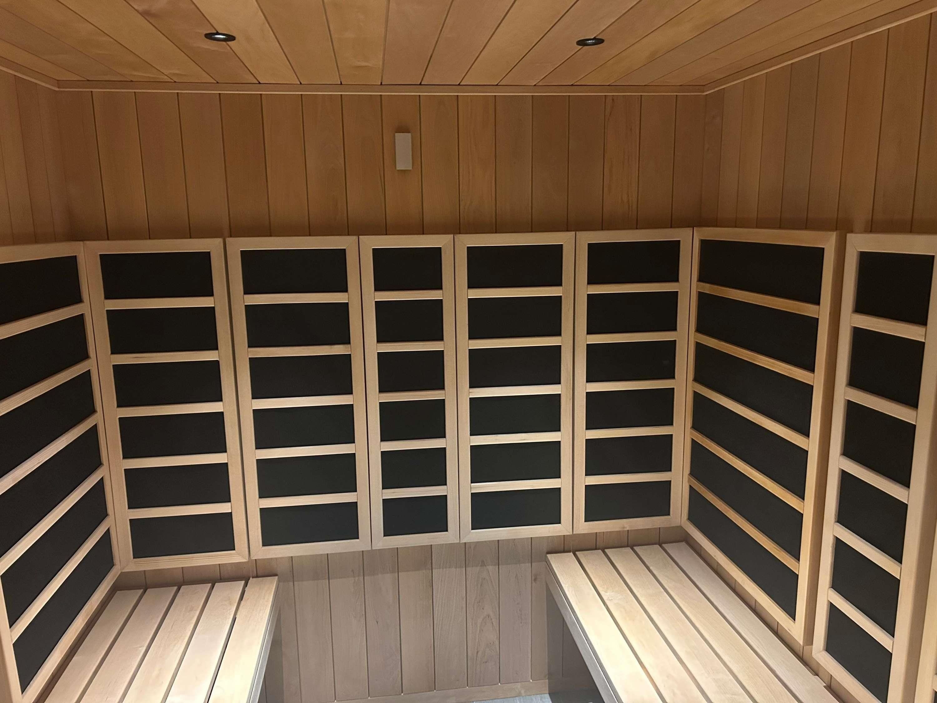 A sauna with wooden walls and benches.
