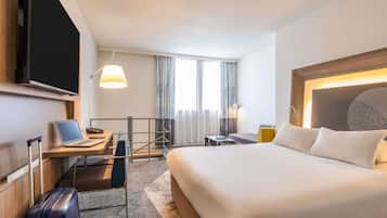 Hypo-allergenic bedding, free minibar items, in-room safe, desk