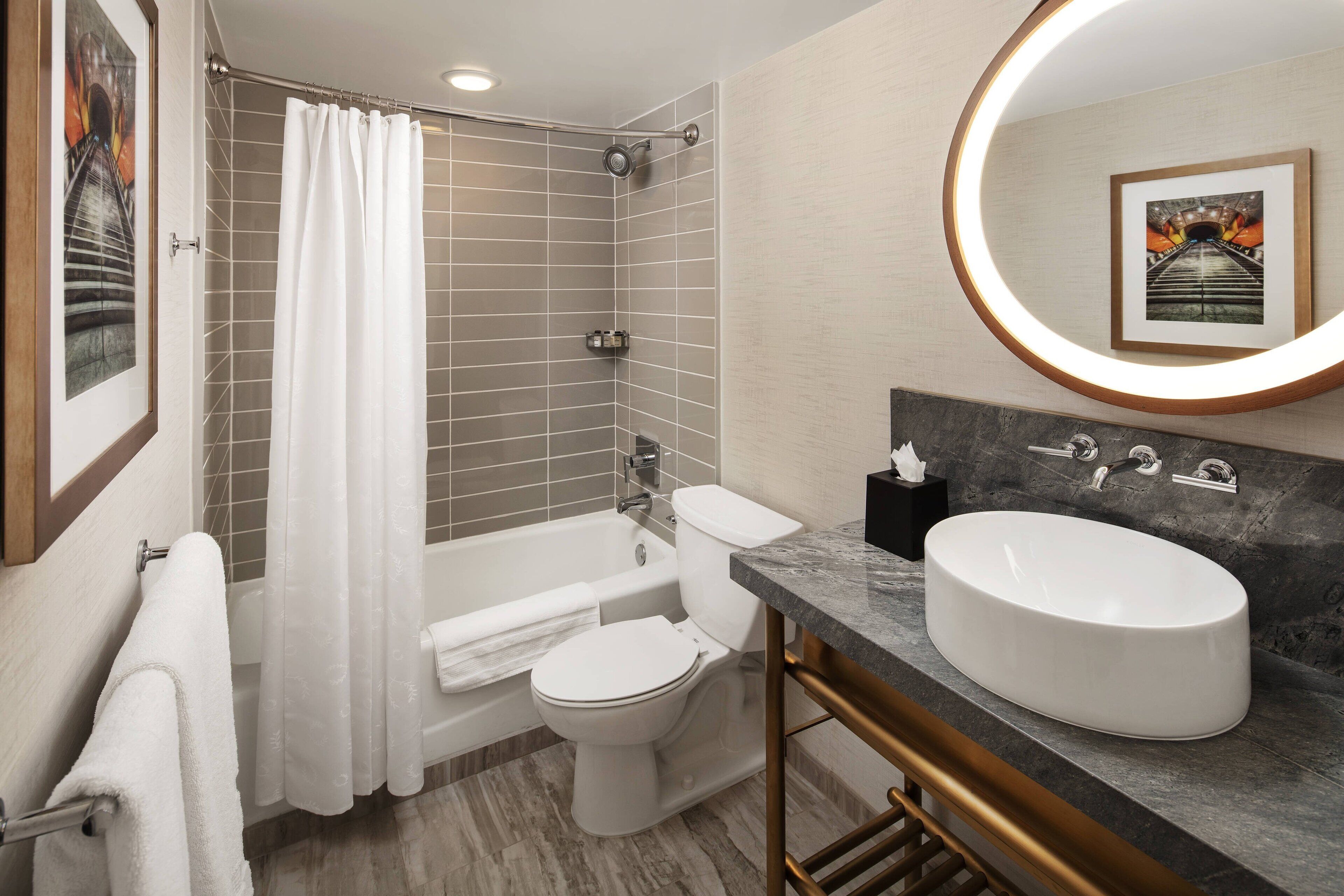 combined shower/bathtub, designer toiletries, hair dryer, bathrobes