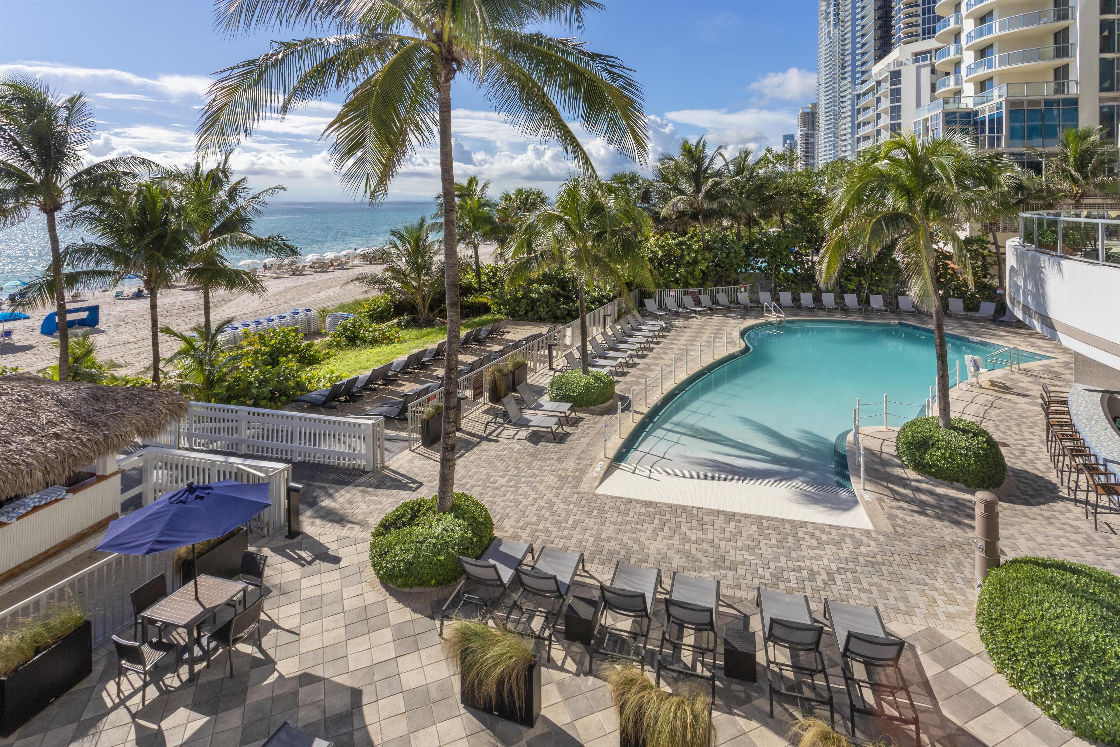 Outdoor pool, pool umbrellas, pool loungers
