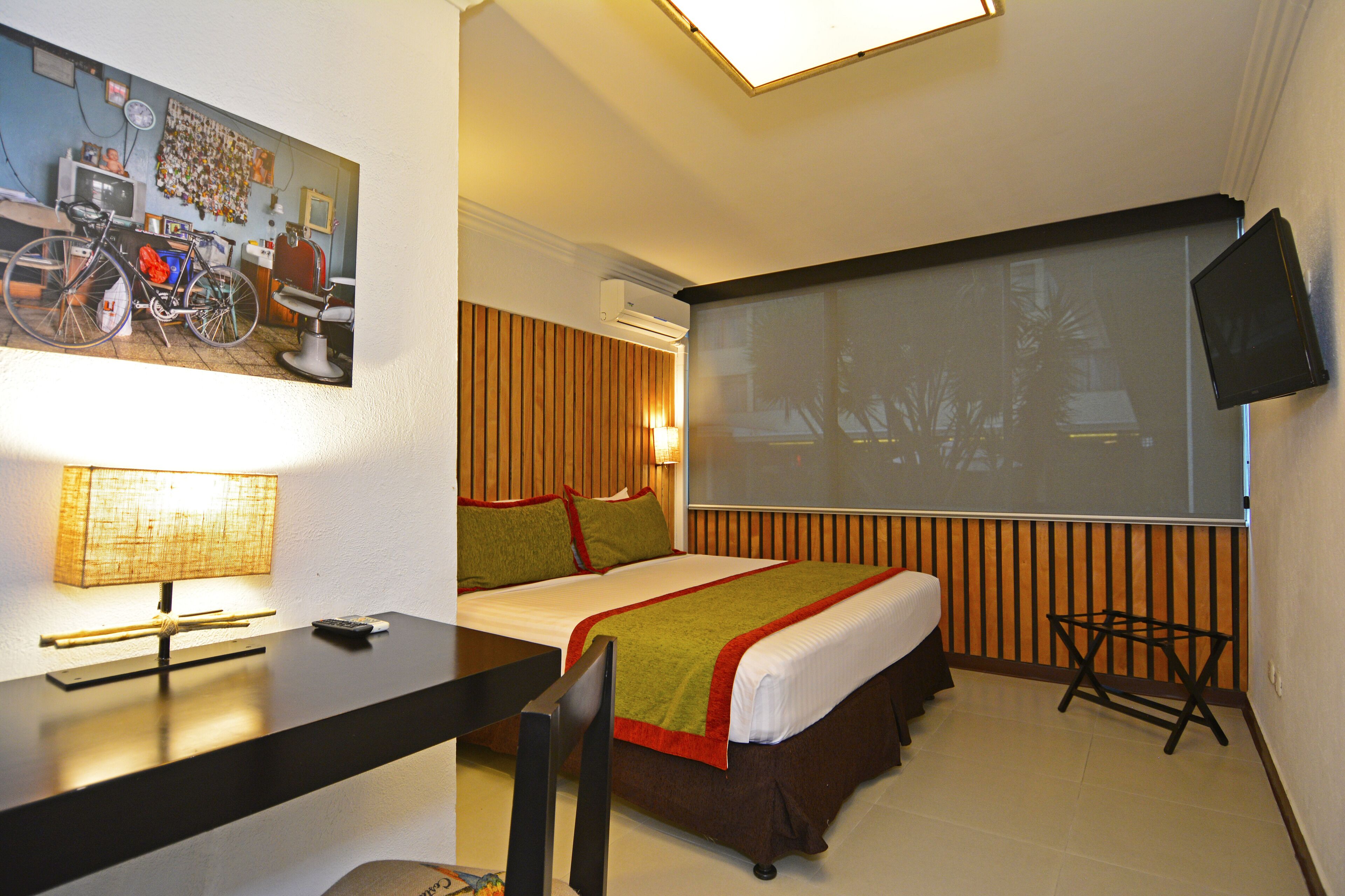 deluxe double room | in-room safe, individually decorated, desk, laptop workspace
