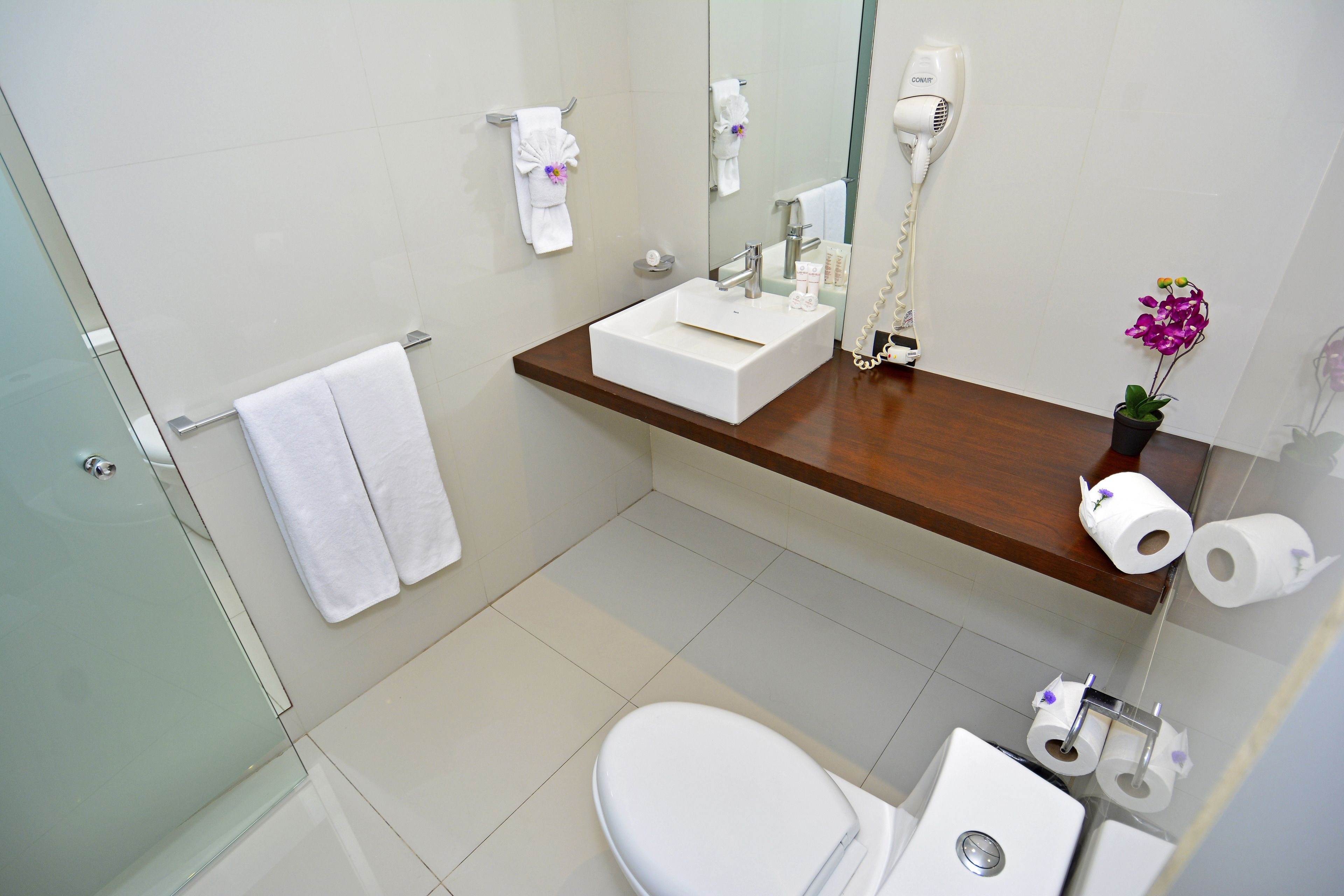 junior suite, 2 queen beds | bathroom | shower, free toiletries, hair dryer, towels