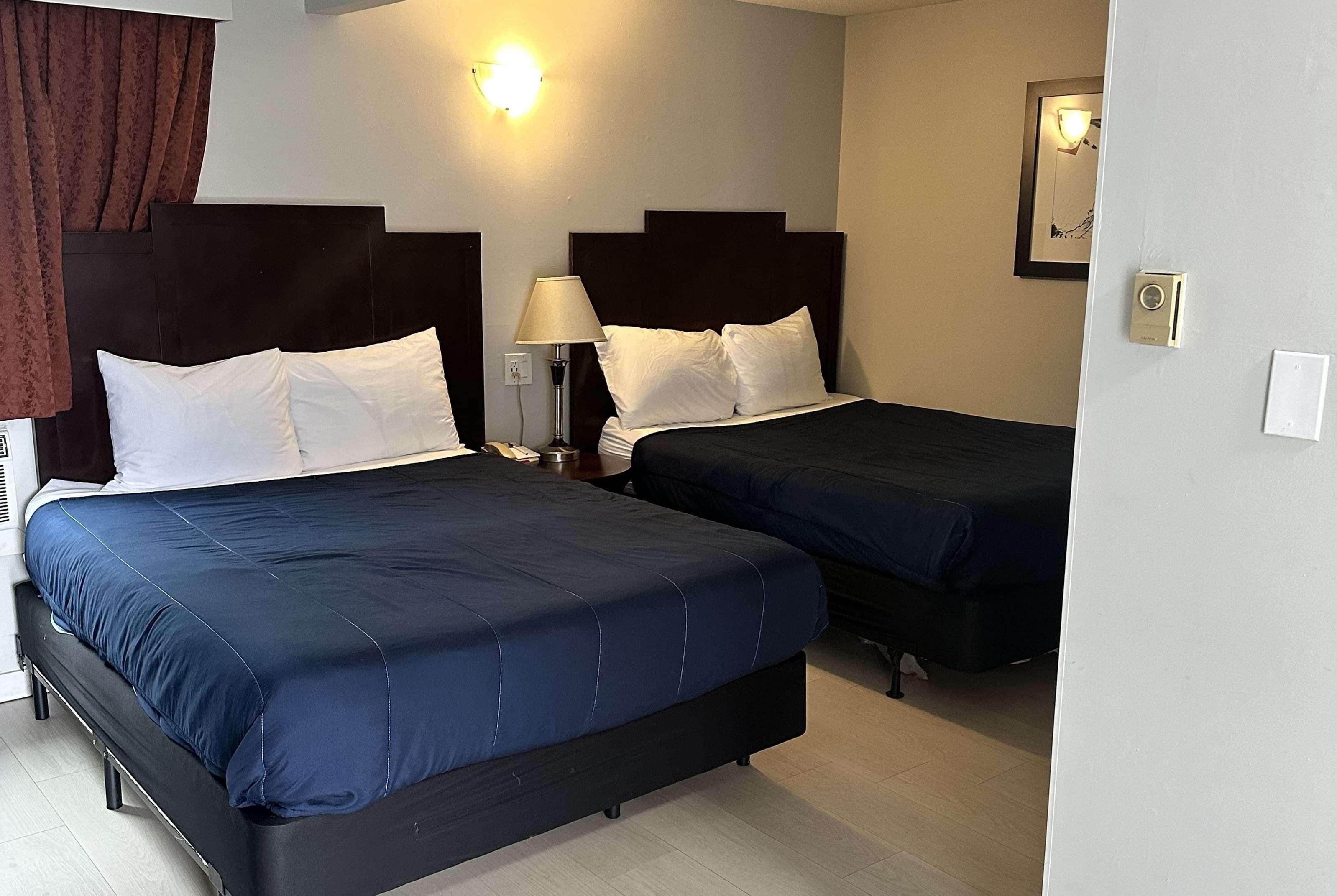 Deluxe Room, 2 Queen Beds, Non Smoking | Iron/ironing board, free WiFi, bed sheets